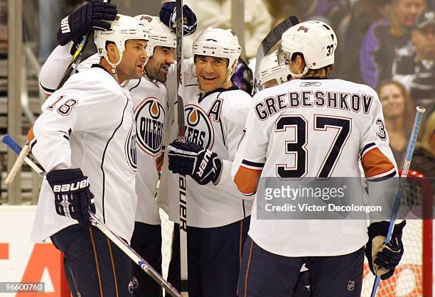 Ethan Moreau, Zack Stortini, Steve Staios and Denis Grebeshkov of the Edmonton Oilers celebrate a second period goal credited to Grebeshkov against...