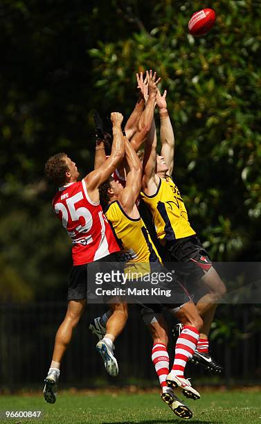 Ted Richards and Paul Bevan of the Swans compete for a mark during a Sydney Swans intra-club AFL match at Lakeside Oval on February 12, 2010 in...