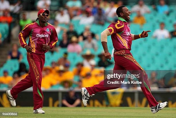 Kieron Pollard of the West Indies celebrates taking the wicket of Cameron White of Australia during the Third One Day International match between...