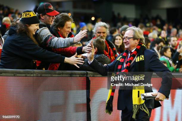 Legend Kevin Sheedy does a lap of honour as he celebrates with fans during the round 11 AFL match between the Essendon Bombers and the Richmond...