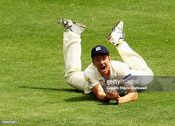 Damien Wright of the Bushrangers holds a catch to dismiss Phil Jaques of the Blues off the bowling of Darren Pattinson during day one of the...