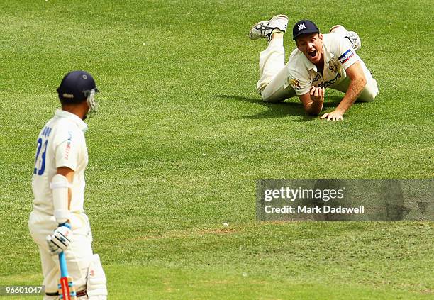 Phil Jaques of the Blues watches as Damien Wright of the Bushrangers holds a catch to dismiss him off the bowling of Darren Pattinson during day one...