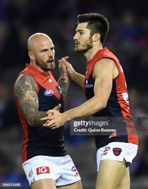 Nathan Jones and Alex Neal-Bullen of the Demons celebrates a goal during the round 11 AFL match between the Western Bulldogs and the Melbourne Demons...