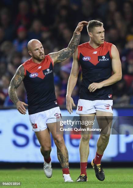 Tom McDonald of the Demons is congratulated by Nathan Jones after kicking a goal during the round 11 AFL match between the Western Bulldogs and the...