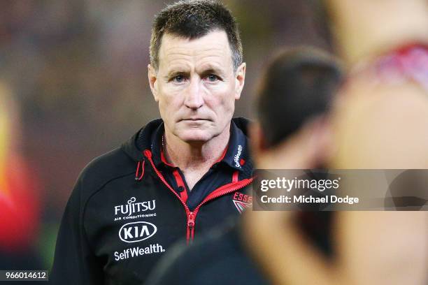 Bombers head coach John Worsfold walks off at at three quarter time during the round 11 AFL match between the Essendon Bombers and the Richmond...