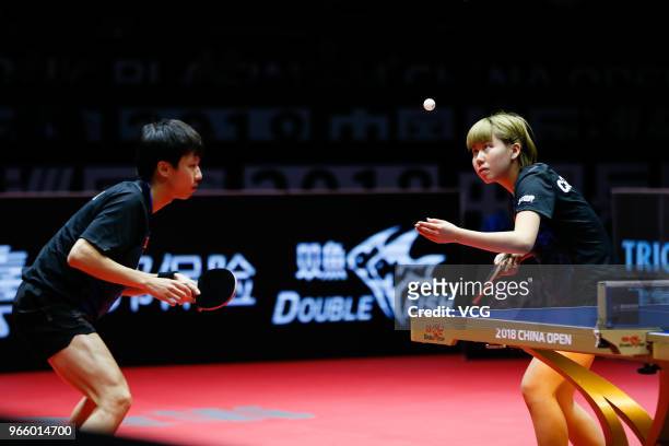 Lin Gaoyuan of China and Chen Xingtong of China compete in the Mixed Doubles final match against Ito Mima of Japan and Masataka Morizono of Japan...