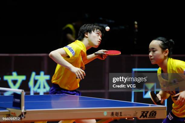 Ito Mima of Japan and Masataka Morizono of Japan compete in the Mixed Doubles final match against Lin Gaoyuan of China and Chen Xingtong of China...