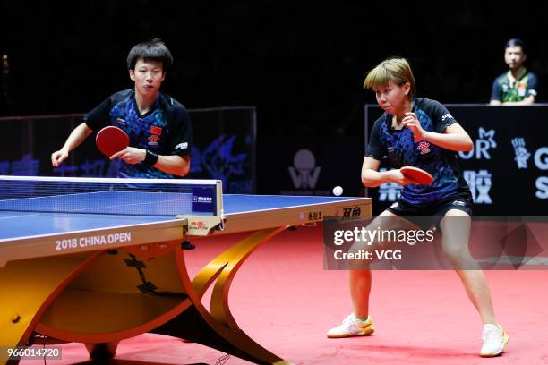 Lin Gaoyuan of China and Chen Xingtong of China compete in the Mixed Doubles final match against Ito Mima of Japan and Masataka Morizono of Japan...