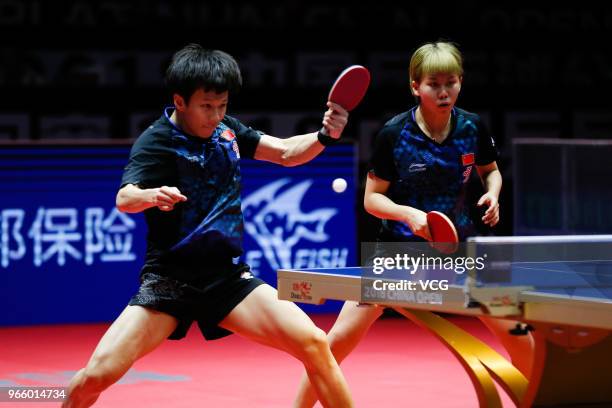 Lin Gaoyuan of China and Chen Xingtong of China compete in the Mixed Doubles final match against Ito Mima of Japan and Masataka Morizono of Japan...