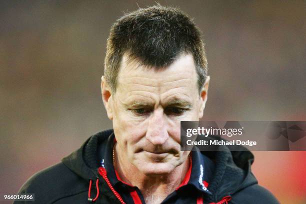 Bombers head coach John Worsfold walks off at at three quarter time during the round 11 AFL match between the Essendon Bombers and the Richmond...