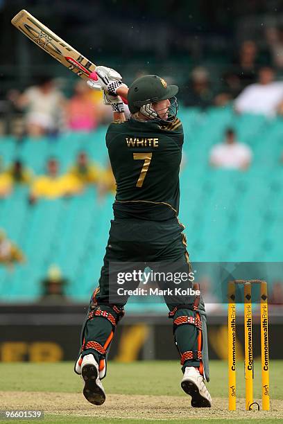 Cameron White of Australia slashes at a ball outside off stump during the Third One Day International match between Australia and the West Indies at...