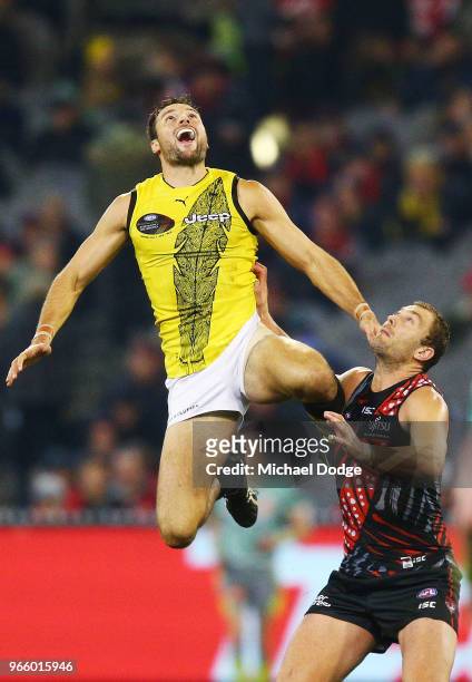 Toby Nankervis of the Tigers competes for the ball over Tom Bellchambers of the Bombers during the round 11 AFL match between the Essendon Bombers...