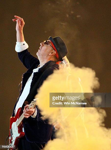 Musician Pete Townshend of The Who performs at halftime of Super Bowl XLIV between the Indianapolis Colts and the New Orleans Saints on February 7,...