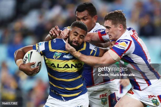 Michael Jennings of the Eels is tackled by Connor Watson of the Knights during the round 13 NRL match between the Parramatta Eels and the Newcastle...