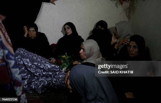 The mother of 21 years old Razan al-Najjar mourns during her funeral after she was shot dead by Israeli soldiers, in Khan Yunis on June 2, 2018. A...