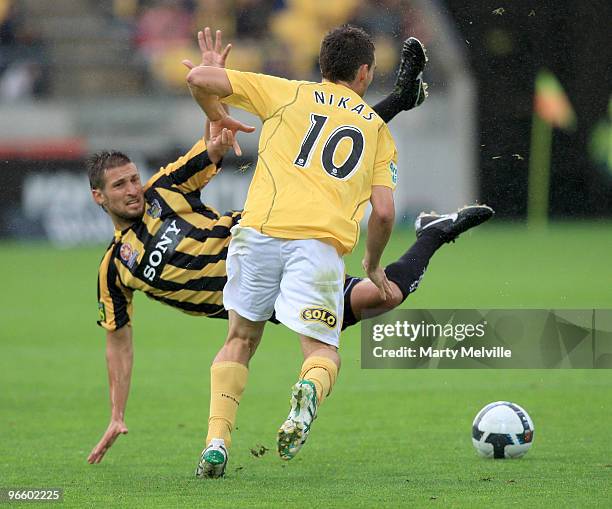 Panagiotis Nikas of the Mariners is tackled by Vince Lia of the Phoenix during the round 27 A-League match between the Wellington Phoenix and the...