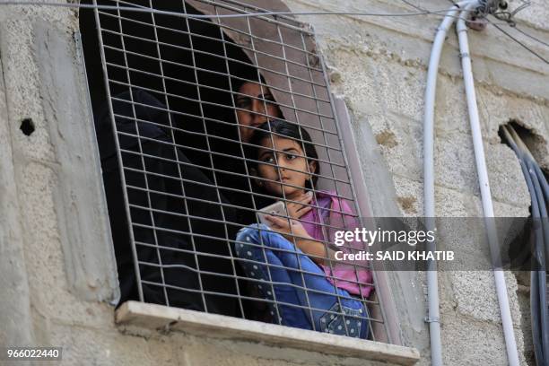 Palestinian people attend the funeral of 21 years old Razan al-Najjar after she was shot dead by Israeli soldiers, in Khan Yunis on June 2, 2018. A...