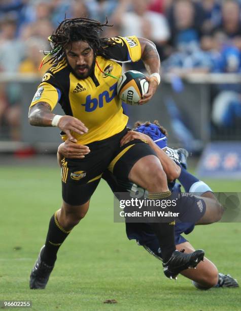 Ma'a Nonu of the Hurricanes is tackled to the ground during the round one Super 14 match between the Blues and the Hurricanes at North Harbour...