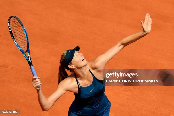Russia's Maria Sharapova serves the ball to Czech Republic's Karolina Pliskova during their women's singles third round match on day seven of The...