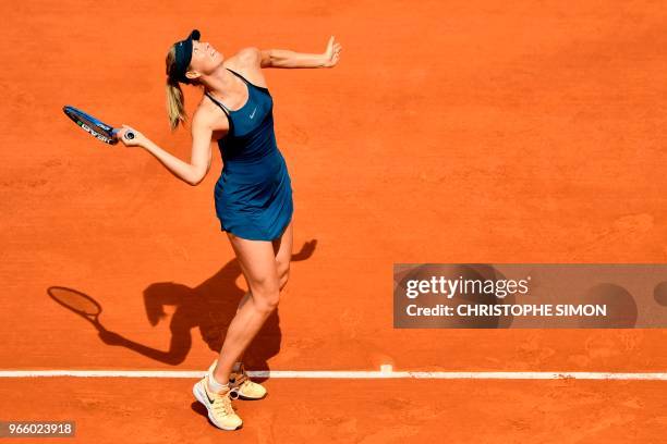 Russia's Maria Sharapova serves the ball to Czech Republic's Karolina Pliskova during their women's singles third round match on day seven of The...