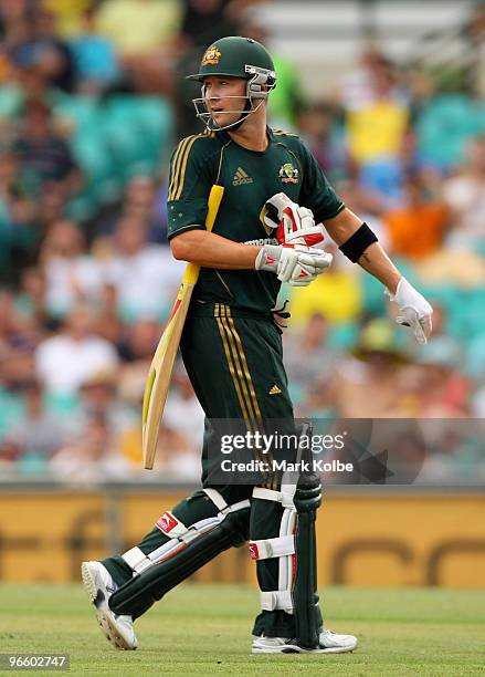 Michael Clarke of Australia looks back and exchanges words with the West Indies team after being dismissed during the Third One Day International...