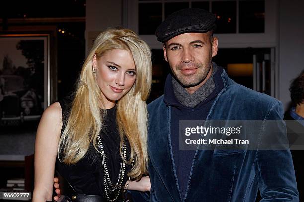 Amber Heard and Billy Zane attend the Tasya Van Ree Charity Photo Exhibition at The Celebrity Vault on February 11, 2010 in Beverly Hills, California.