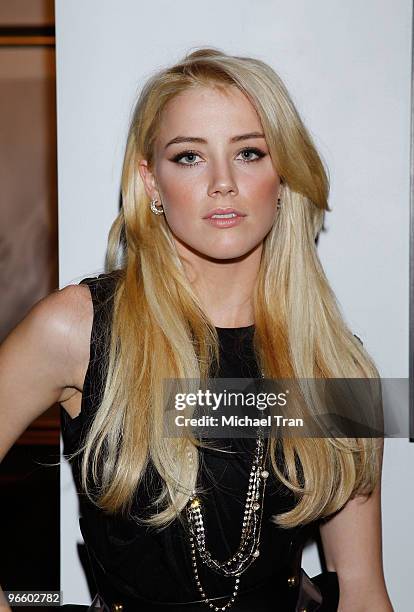 Amber Heard attends the Tasya Van Ree Charity Photo Exhibition held at The Celebrity Vault on February 11, 2010 in Beverly Hills, California.