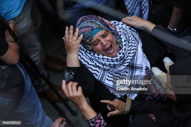 Palestinians mourn during the funeral ceremony of Razan Ashraf Najjar a female paramedic who was shot dead by Israeli forces while healing wounded...