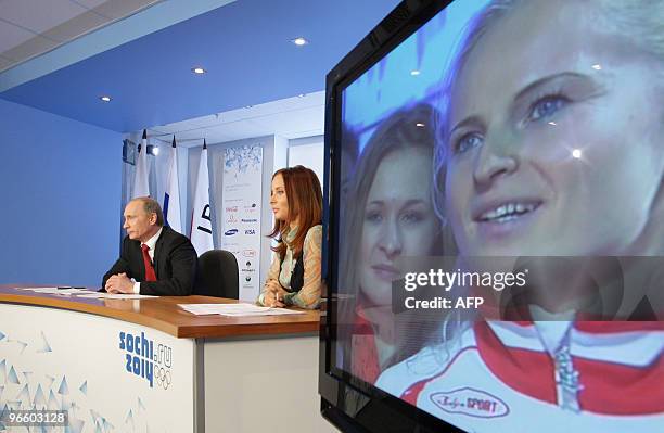 Russian Prime Minister Vladimir Putin speaks with Russian Olympic team athletes in Vancouver from Moscow on February 11, 2010 to wish them luck in...