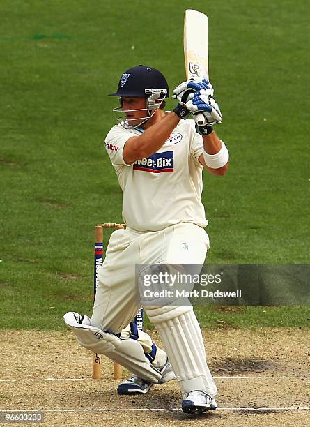 Peter Forrest of the Blues hits a square cut during day one of the Sheffield Shield match between the Victorian Bushrangers and the New South Wales...