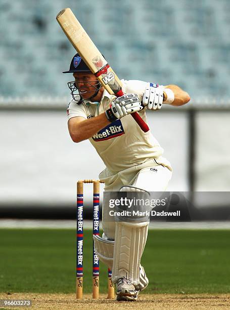 Dominic Thornley of the Blues plays a straight drive during day one of the Sheffield Shield match between the Victorian Bushrangers and the New South...