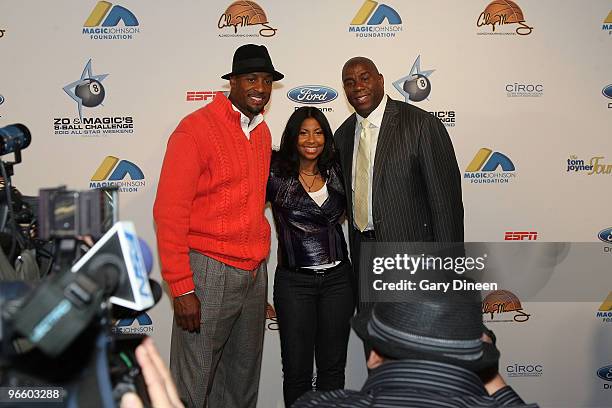 Legend Alonzo Mourning, Cookie Johnson, and NBA Legend Earvin "Magic" Johnson pose for a photograph during Zo and Magic's 8-Ball challenge on...