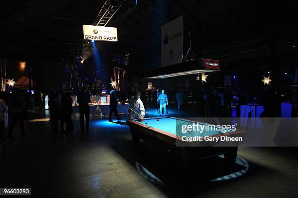 Participant lines up his shot during Zo and Magic's 8-Ball challenge on February 11, 2010 at Centennial Hall at Fair Park in Dallas, Texas. NOTE TO...