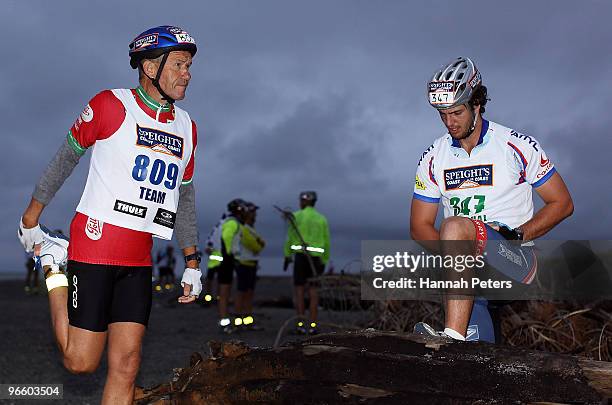 Grant O'Fee of Nelson and Patrick Senior of Auckland warm up before starting on day one during the Speight's Coast to Coast multisport race on...