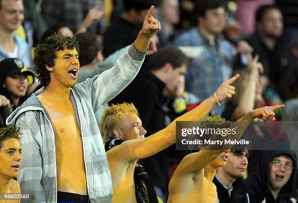 Phoenix fans celebrate during the round 27 A-League match between the Wellington Phoenix and the Central Coast Mariners at Westpac Stadium on...