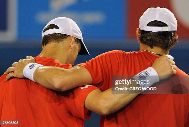 Bob Bryan of the US embraces doubles partner and brother Mike Byran of the US following their victory over Daniel Nestor of Canada and Nenad Zimonjic...