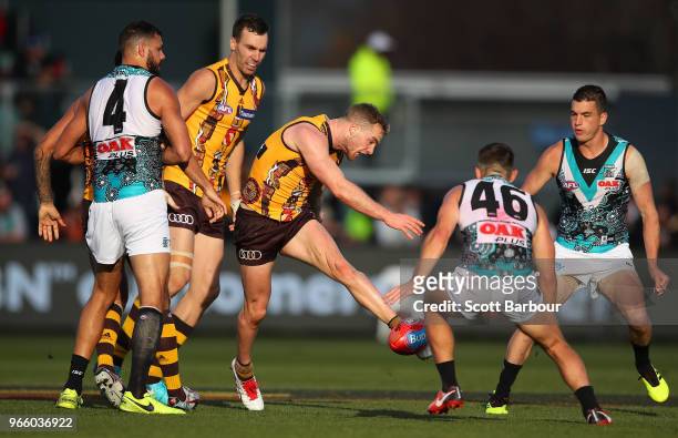 Tom Mitchell of the Hawks competes for the ball during the round 11 AFL match between the Hawthorn Hawks and the Port Adelaide Power at University of...
