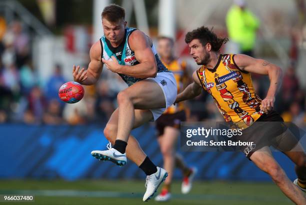 Ollie Wines of the Power competes for the ball during the round 11 AFL match between the Hawthorn Hawks and the Port Adelaide Power at University of...