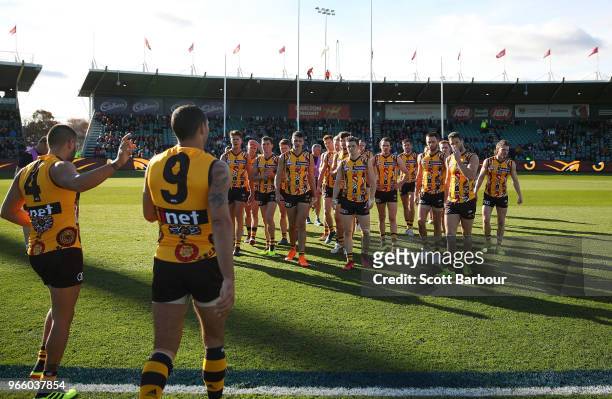Jarman Impey of the Hawks and Shaun Burgoyne of the Hawks speak the players during the round 11 AFL match between the Hawthorn Hawks and the Port...