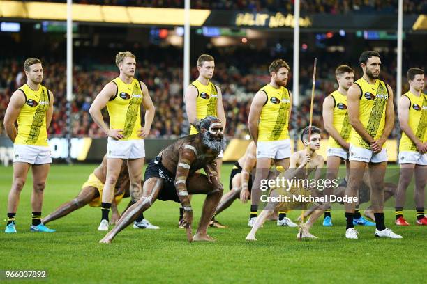 Shane Edwards of the Tigers lines up as the Indigenous ceremony takes place during the round 11 AFL match between the Essendon Bombers and the...