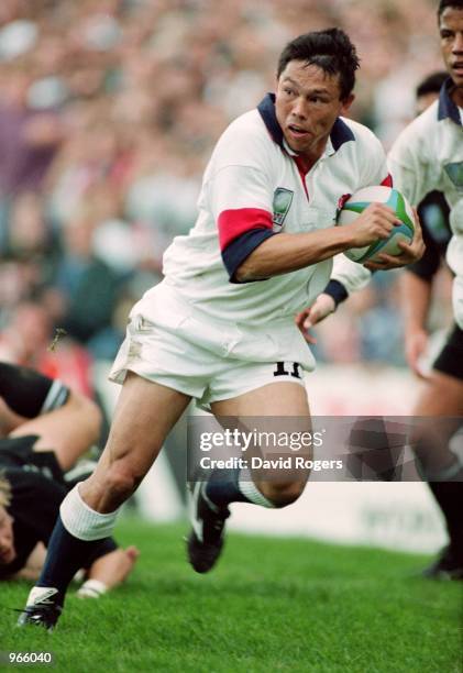 Rory Underwood of England runs with the ball during the 1995 Rugby World Cup match between England and New Zealand played in Cape Town, South Africa....