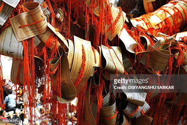 Holy thread is hung near an unseen Shiva statue at a Lord Shiva temple in Bangalore on February 10, 2010. A portion of the temple complex has been...