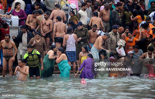 Indian devotees bathe at Har-ki-Pauri in the River Ganges in Haridwar on February 12 during the First Shahi Snan - Royal Bath - on Maha Shivratri at...