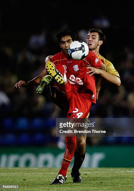 Marcos Flores of Adelaide competes with Ben Kantarovski of the Jets during the round 27 A-League match between the Newcastle Jets and Adelaide United...