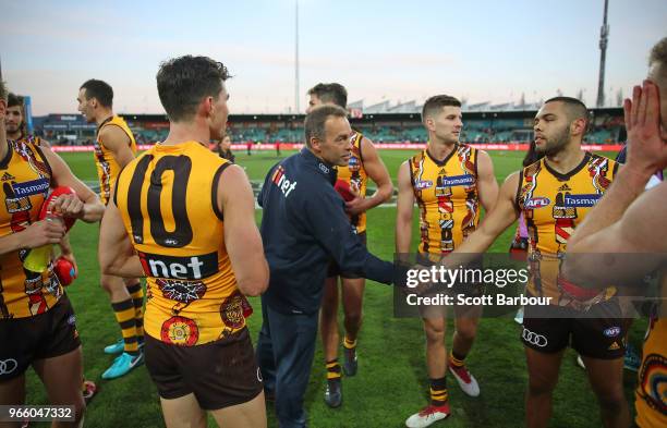 Alastair Clarkson, coach of the Hawks congratulates Jarman Impey of the Hawks after winning the round 11 AFL match between the Hawthorn Hawks and the...