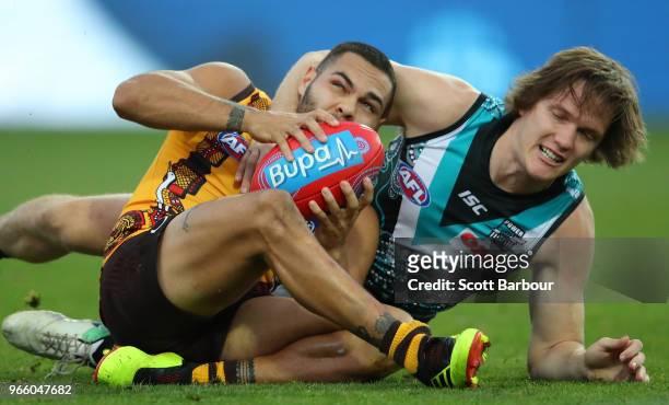 Jarman Impey of the Hawks and Jared Polec of the Power compete for the ball during the round 11 AFL match between the Hawthorn Hawks and the Port...