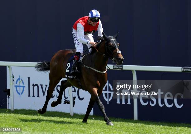 Adam Kirby ridding Connect wins the the Investec Private Banking Handicap on Derby Day at Epsom Downs on June 2, 2018 in Epsom, England.