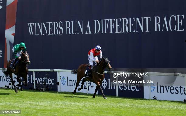 Adam Kirby ridding Connect wins the the Investec Private Banking Handicap on Derby Day at Epsom Downs on June 2, 2018 in Epsom, England.