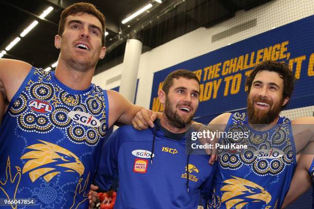 Scott Lycett, Jack Darling and Josh Kennedy of the Eagles sing the club song after winning the round 11 AFL match between the West Coast Eagles and...