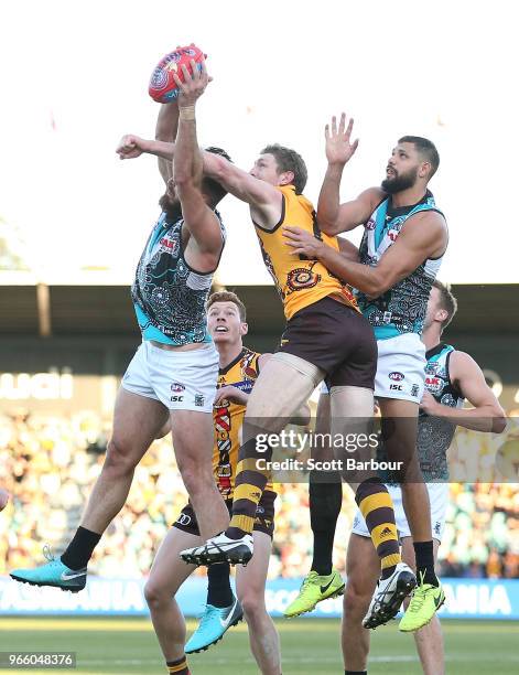 Ben McEvoy of the Hawks, Paddy Ryder of the Power and Justin Westhoff of the Power compete for the ball during the round 11 AFL match between the...
